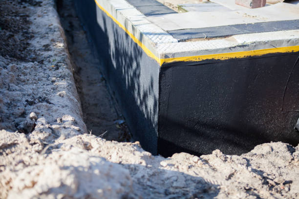 Professional Waterproofing technician working in Madison, AL